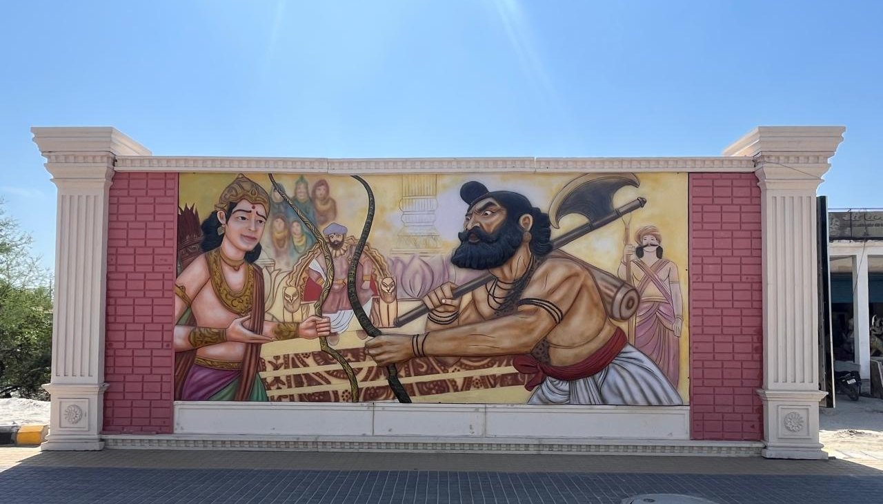 Painted FRP relief mural of Lord Parshuram and Lord Ram set in a wall with white pillars along Dharmapath, Ayodhya