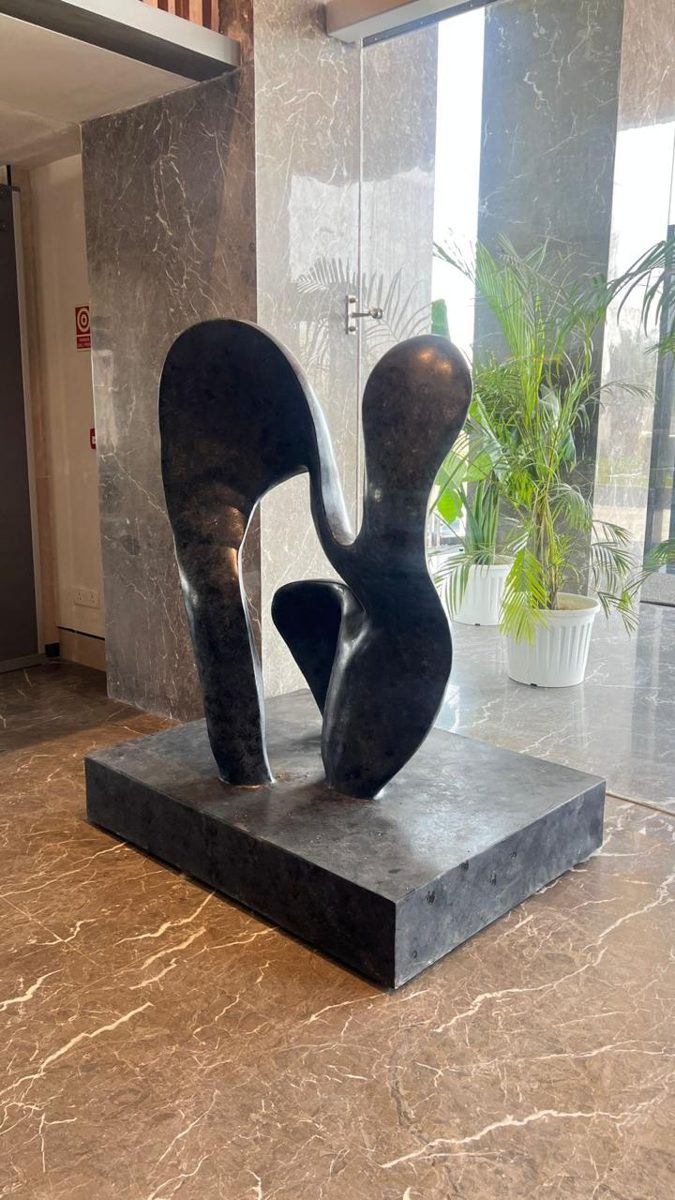 Abstract dark-finish sculpture in a hotel lobby